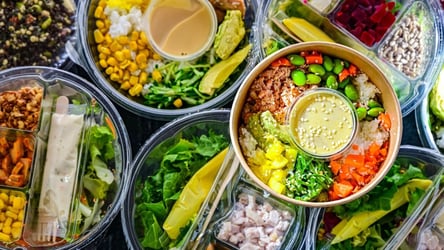 Plastic boxes with pre-packaged vegetable salads