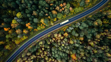Aerial view of heavy truck on a narrow twisting road