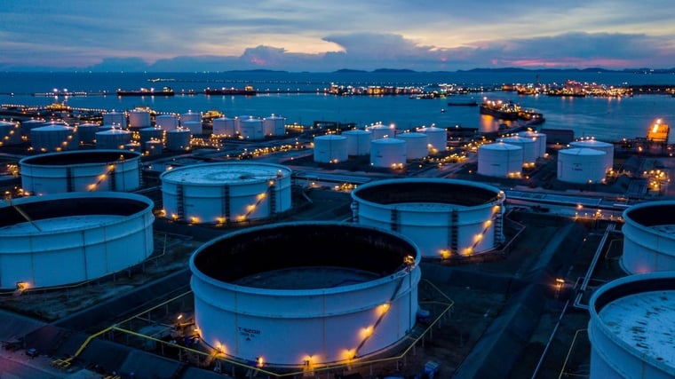 Aerial view oil terminal is industrial facility for storage of oil and petrochemical products ready for transport to further storage facilities. 