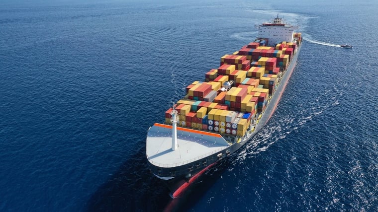 Aerial drone panoramic ultra wide photo of industrial truck size container tanker ship cruising in open ocean deep blue sea