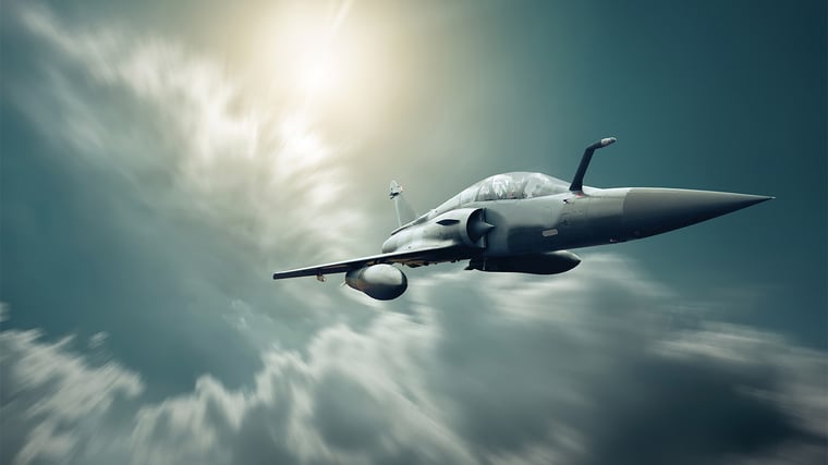 Military airplan on the speed in the sky