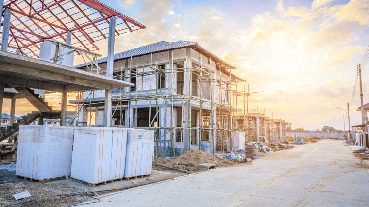 home construction site, with pallets of construction materials