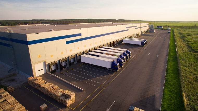 distribution warehouse with trucks of different capacities